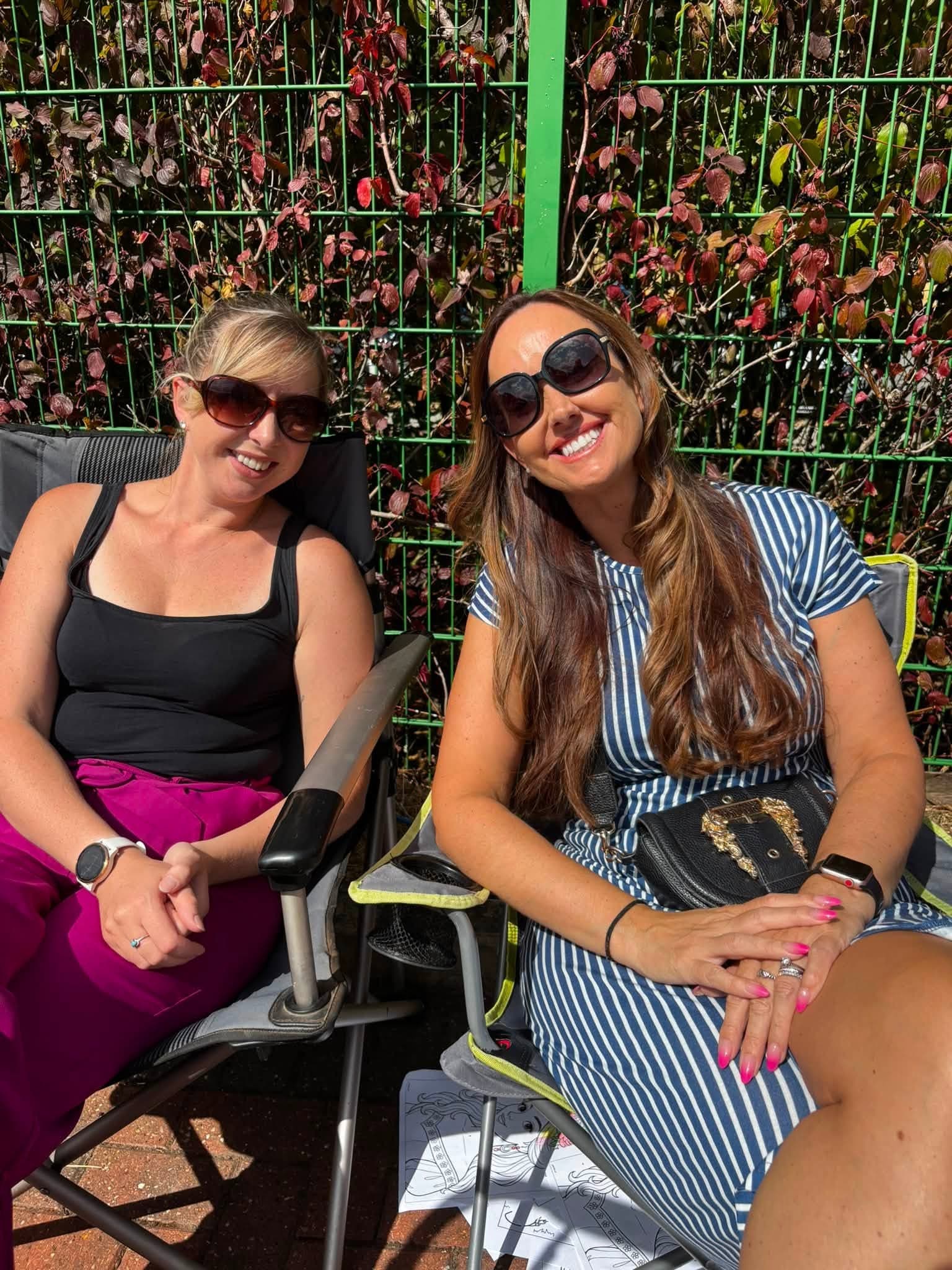 Two Your Home Care team members smiling together at the annual BBQ