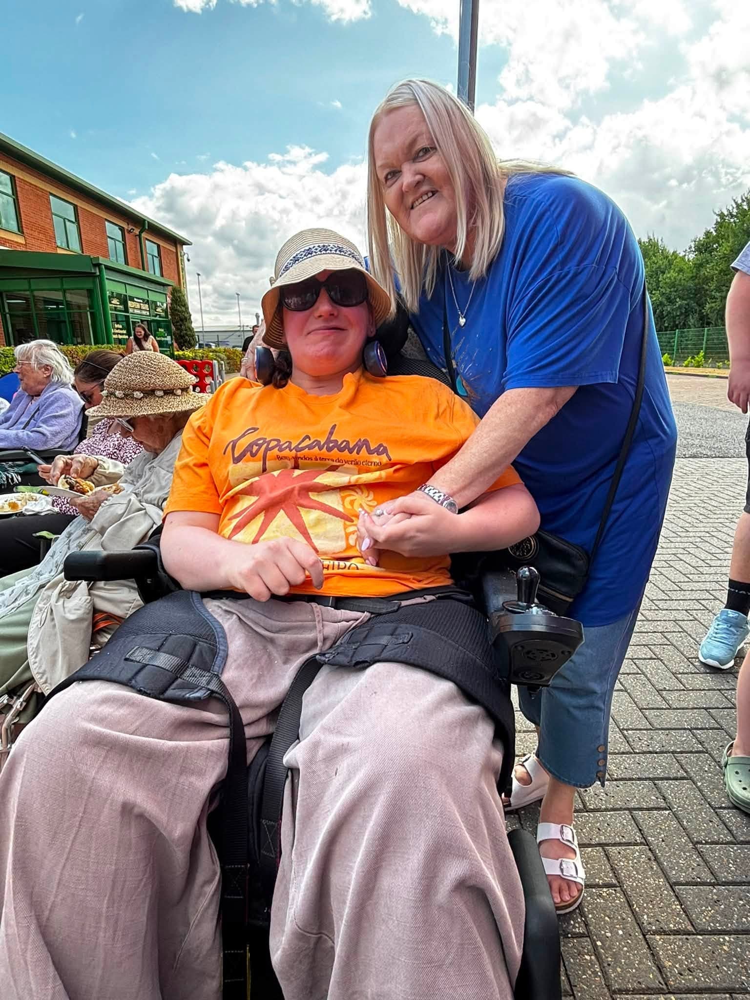 A Your Home Care team member with a client at the annual BBQ