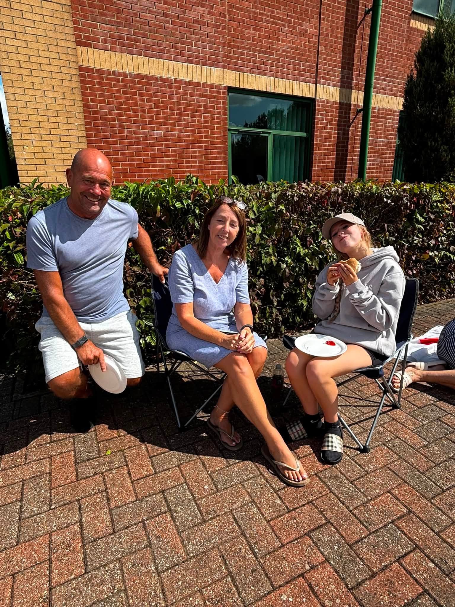 Guests relaxing together outside at the annual BBQ