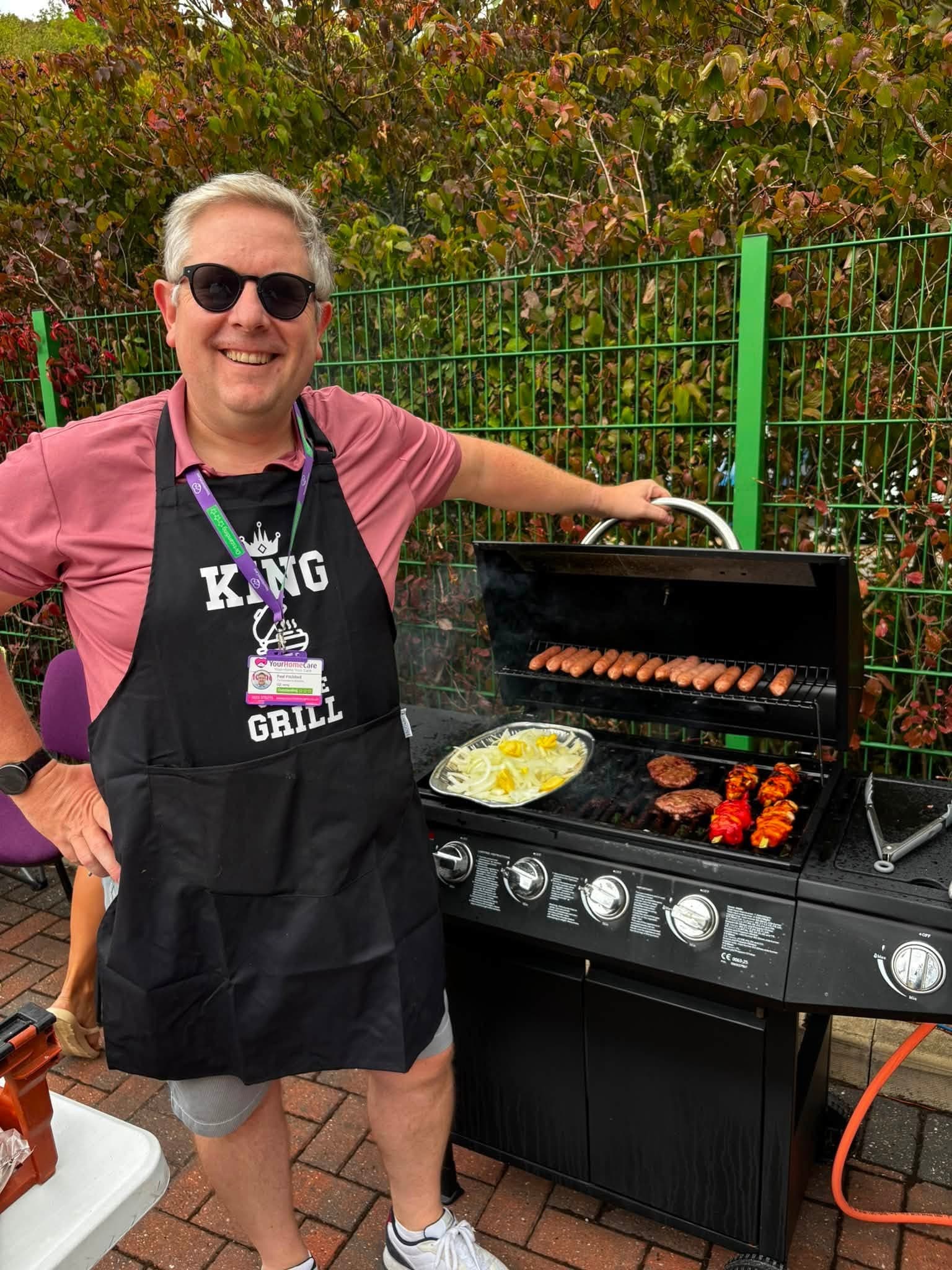 Your Home Care co-founder Paul cooking at the barbecue grill