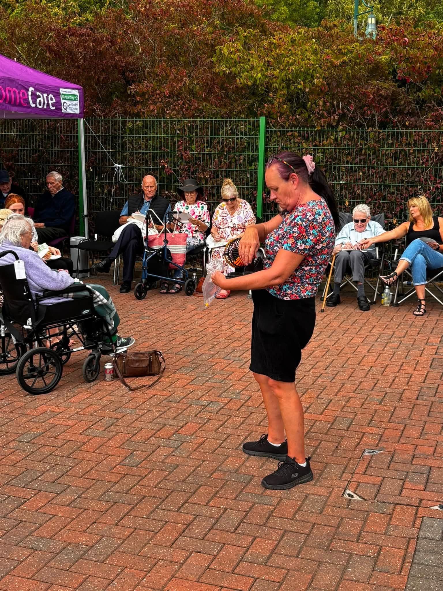 Prize bingo taking place outside during the annual BBQ