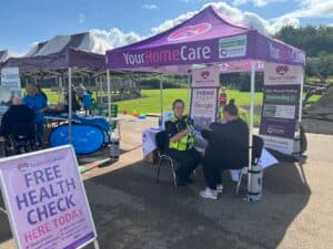 Tayla completing a health check on a PCSO at the Ashfield Wellbeing event