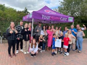 Staff underneath Your Home Care gazebo