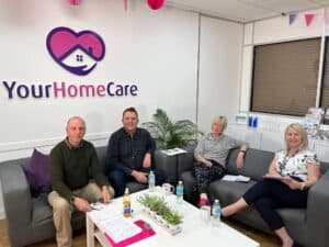 John B Tannen, Jono Edwards, Maureen Hutchby, Denise Pitts together in the Your Home Care office.